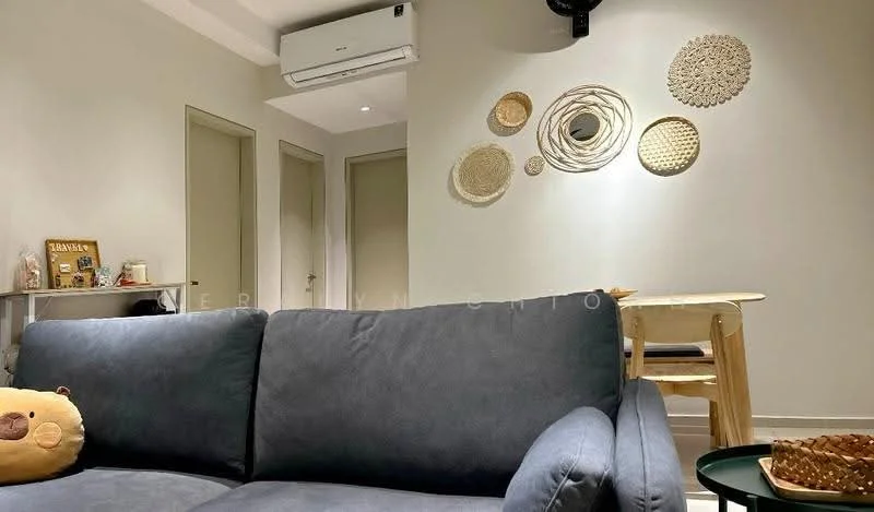 Living features: grey fabric sofa, wall-mounted air conditioning unit, light grey painted walls, wooden dining table, woven wall decor, open shelving unit, light flooring, floor lamp; style: modern.