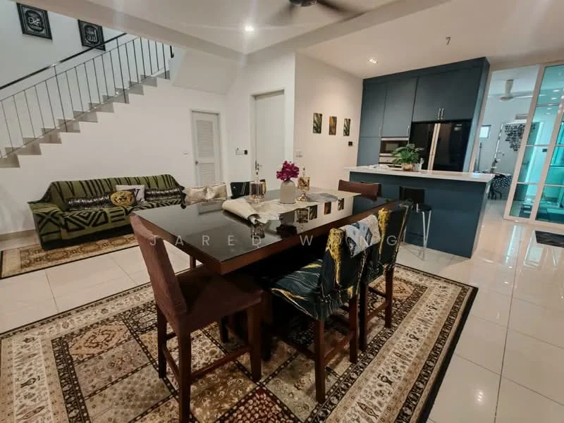 Dining features: dark wooden dining table, 4 upholstered dining chairs, decorative table runner, framed artwork on walls, area rug with intricate pattern, green fabric sofa with geometric pattern, white tiled flooring, ceiling fan, open layout to kitchen, staircase in background; style: modern. Kitchen features: blue cabinetry, stainless-steel refrigerator, kitchen island with seating, white countertop, built-in oven, microwave, recessed lighting; style: modern.