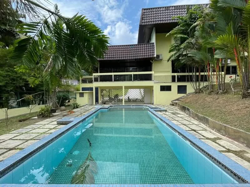 Exterior type: detached bungalow; features: swimming pool, pool deck with loungers, manicured lawn, tropical landscaping, paved walkway, two-storey building, balcony with railing, sloped garden, exposed concrete facade, roof with tiles; style: tropical-modern.