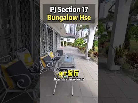Room features: outdoor seating area, glass-top coffee table, metal frame chairs with cushions, tiled flooring, surrounding greenery, decorative plants, covered patio, open layout; style: modern; view: garden.