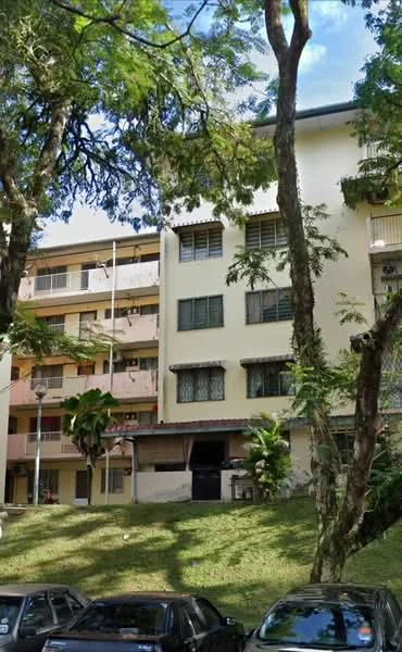 Exterior type: low-rise apartment block; features: yellow painted facade, multiple storeys, balconies on upper floors, large windows, surrounded by trees, manicured lawn, parking area in front, street lamps, visible entrance, greenery around the building; style: traditional.