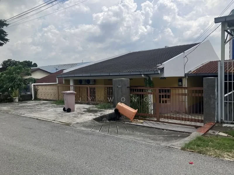 Exterior type: semi-detached house; features: single-storey, grey tiled roof, cream painted facade, front porch with driveway, fenced yard, manicured lawn, paved walkway, visible garbage bins, surrounded by residential area, street view; style: modern.
