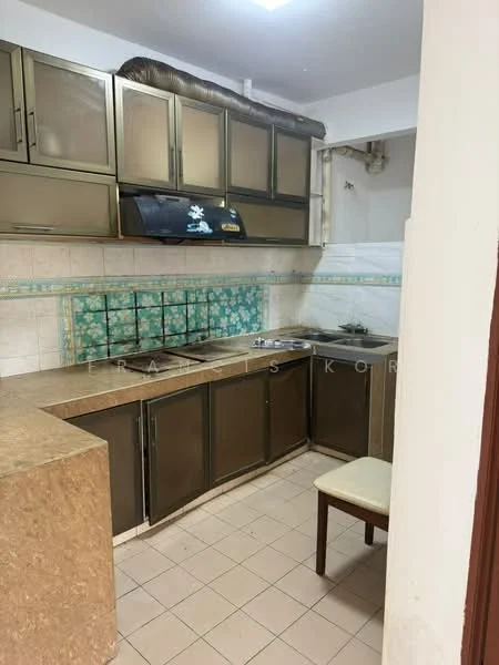 Kitchen features: brown cabinetry with glass doors, marble countertop, white tiled backsplash with floral pattern, built-in gas stove, exhaust hood, single-bowl stainless-steel sink, wall-mounted pipework, ceramic tile flooring, under-cabinet lighting, wooden chair.