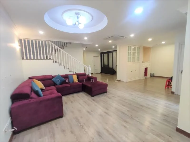 Living features: L-shape sectional sofa in burgundy, decorative cushions in various colors, wooden flooring, recessed ceiling with chandelier, white painted walls, staircase with white railing, air conditioning unit, wall-mounted TV, open layout to adjacent rooms; style: modern.