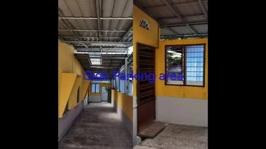 Exterior features: side parking area, yellow painted walls, concrete flooring, metal roof, windows with wooden frames, sliding window, open corridor, decorative window grille.