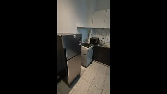 Kitchen features: stainless-steel fridge, front-load washing machine, white upper cabinets, dark lower cabinets, grey tiled backsplash, grey tile flooring, single-bowl stainless-steel sink, chrome pull-down faucet, countertop with space for appliances, wall-mounted cabinet above sink; style: modern.
