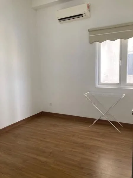 Room features: white painted walls, laminate flooring, 1 wall-mounted split AC, window with sheer curtains, folding drying rack.
