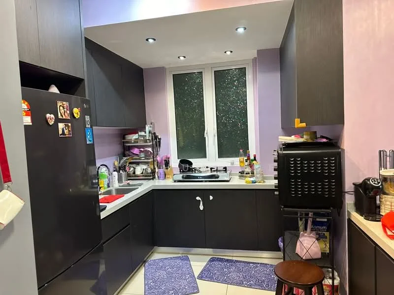 Kitchen features: black cabinetry, white countertop, stainless-steel gas stove, black fridge, sink with faucet, window with view to outside, purple painted walls, tile flooring, kitchen mats, kitchen utensils on countertop, wall-mounted shelves, appliances including blender and coffee machine; style: modern.
