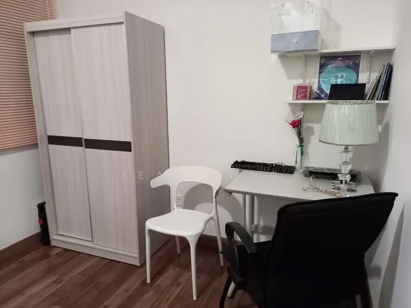Study features: light wood wardrobe with sliding doors, white chair, black office chair, small desk with light grey surface, keyboard on desk, table lamp with green shade, shelf with books and decorative items, wooden flooring, window with blinds; style: modern.