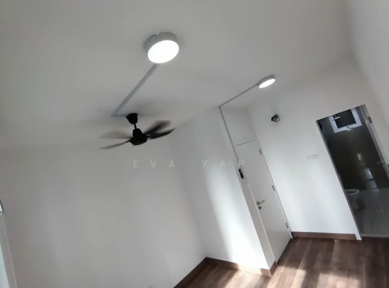 Room features: white painted walls, wooden flooring, 5-blade ceiling fan with light, recessed downlights, door, window, bathroom door visible.