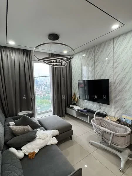 Living features: grey fabric sectional sofa, light grey throw pillows, white coffee table, wall-mounted TV, TV console, marble accent wall, floor-to-ceiling windows, sheer curtains, recessed LED downlights, modern chandelier, baby crib, decorative items on console; style: modern; view: city.