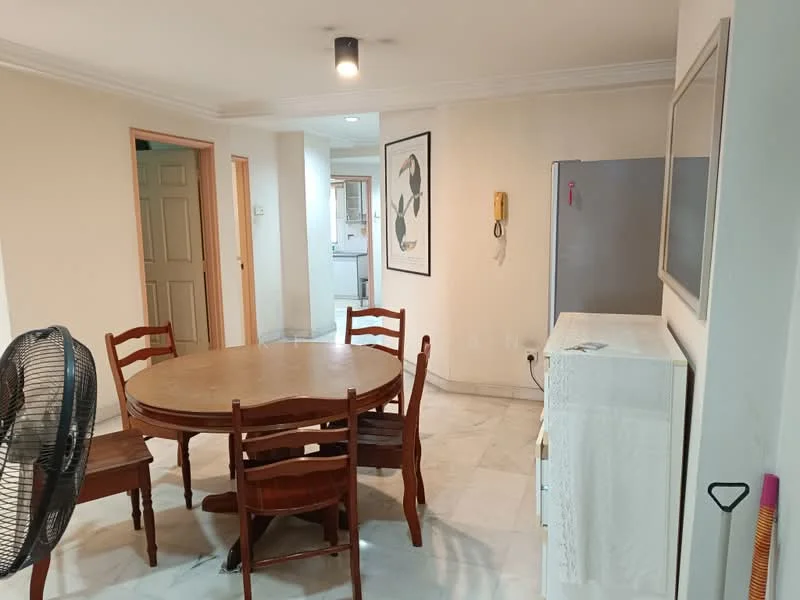 Dining features: round wooden dining table, 4 wooden dining chairs, marble flooring, white painted walls, ceiling light fixture, wall-mounted phone, framed artwork on wall, refrigerator, white cabinet, fan. Room features: doorway leading to kitchen, additional room visible in background.