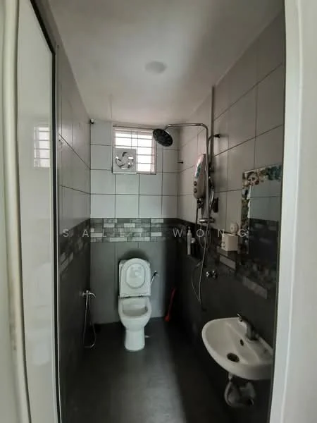 Bathroom features: white toilet, shower with handheld showerhead, wall-mounted shower control, grey tiled walls, dark grey flooring, small white sink, window for natural light, decorative mosaic tile border; style: modern.