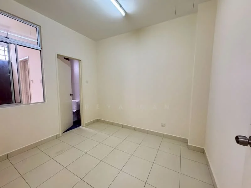 Room features: white painted walls, tile flooring, single window, door leading to bathroom, fluorescent ceiling light.