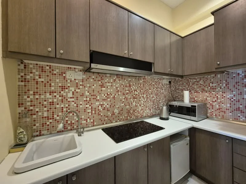 Kitchen features: brown wooden cabinetry, white countertop, single-bowl stainless-steel sink, chrome pull-down faucet, built-in microwave, stainless-steel kettle, black glass cooktop, mosaic tile backsplash with red and beige, refrigerator, under-cabinet lighting; style: modern.