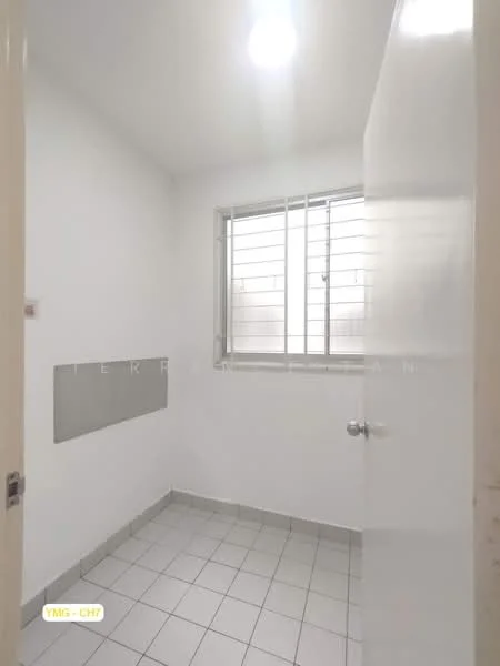 Room features: white painted walls, tile flooring, single window with metal grille, flush white door, ceiling light fixture.