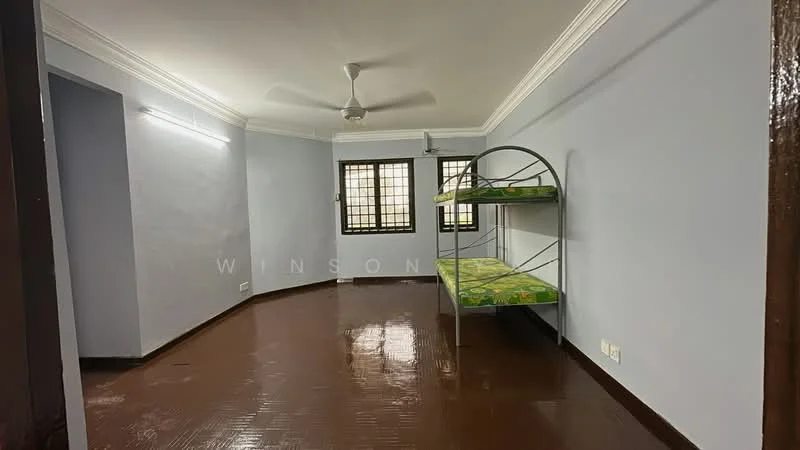 Room features: bunk bed with green bedding, brown vinyl flooring, light grey painted walls, white ceiling with crown moulding, ceiling fan, window with security bars, wall-mounted light fixture; style: minimalist.