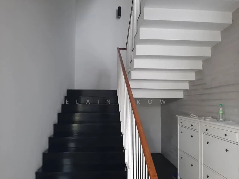 Room features: white painted walls, black wooden staircase, wooden handrail, modern staircase design, built-in cabinets with drawers, minimalist decor, recessed wall lighting; style: modern.
