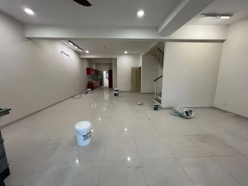 Room features: white painted walls, polished ceramic tile flooring, recessed downlights, ceiling fan, open layout, staircase visible in background, unfinished space with paint buckets, neutral color scheme; style: modern.