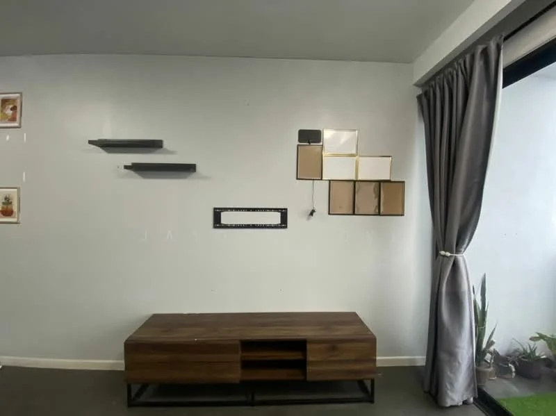 Living features: light grey painted walls, dark wood TV console with storage, floating shelves in dark grey, framed artwork on walls, curtains in light grey, floor-to-ceiling windows, indoor plants, concrete flooring; style: modern.