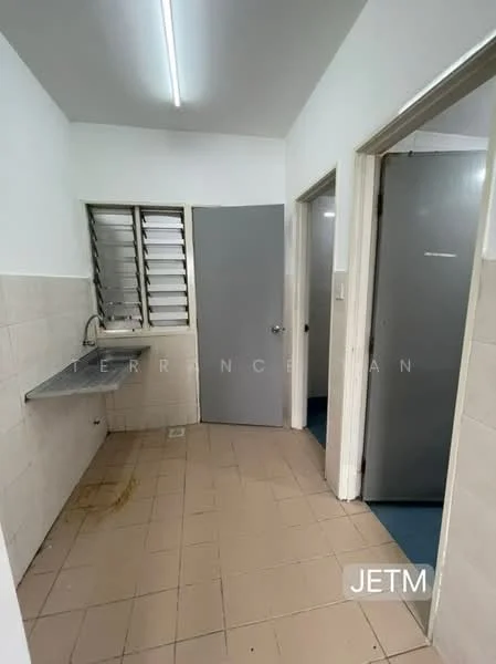 Laundry features: grey wall, white tiled walls, grey floor tiles, metal sink with faucet, window with horizontal slats, door to adjacent room, door to hallway, overhead fluorescent lighting.