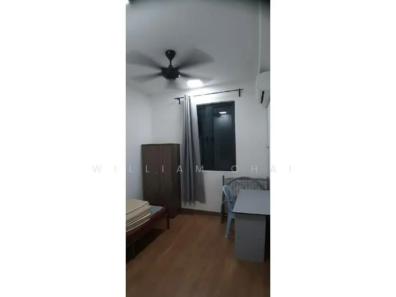 Bedroom features: wooden flooring, white painted walls, 5-blade ceiling fan with light, window with black frame, grey curtains, single bed, wooden wardrobe, study desk, chair; style: modern.