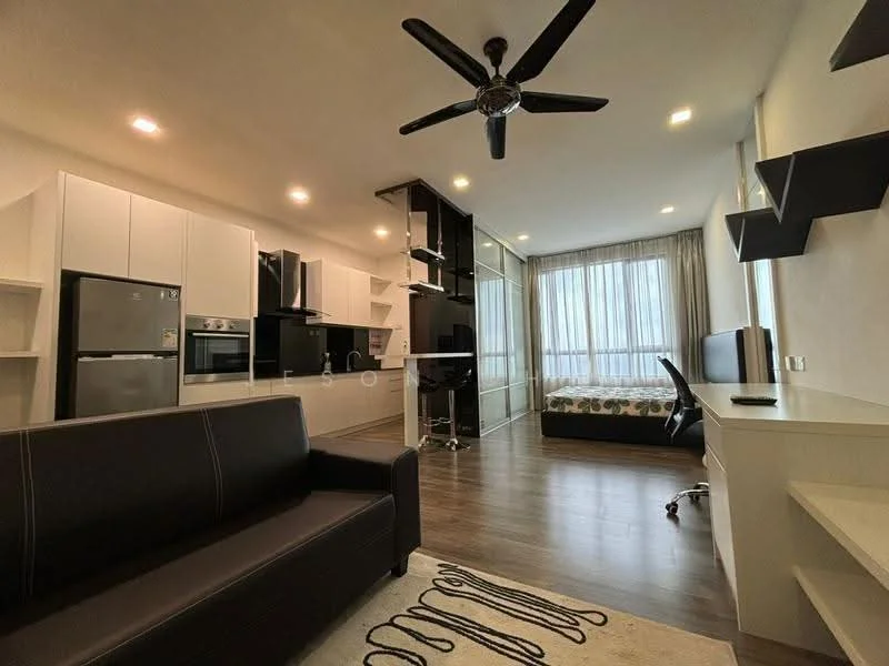 Living features: 3-seater black leather sofa, ceiling fan with light, wall-mounted TV, coffee table, area rug with geometric pattern, laminate flooring, white painted walls, large windows with sheer curtains, built-in shelving unit, black desk with chair, kitchenette with white cabinetry, stainless-steel fridge, built-in oven, microwave; style: modern.