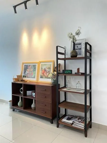 Room features: white painted walls, glossy tile flooring, wooden sideboard with drawers, open shelving unit with black metal frame, decorative vases, framed artwork, digital clock, greenery in vase, books on shelves, decorative items on shelves; style: modern.