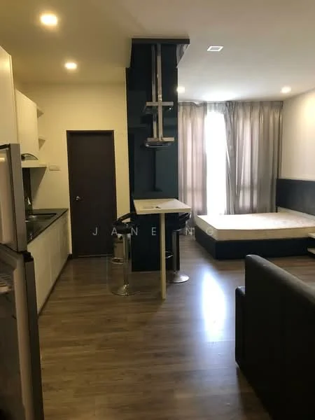 Kitchen features: white cabinetry, black countertop, stainless-steel fridge, built-in oven, ceramic cooktop, single-bowl stainless-steel sink, chrome pull-down faucet, open shelving; style: modern. Living features: laminate flooring, large window with sheer curtains, queen-size bed frame without mattress, sofa in dark color, bar table with stools, wall-mounted TV, recessed lighting; style: modern.