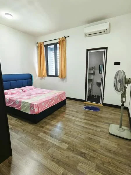 Bedroom features: queen-size bed with pink floral bedding, upholstered headboard in blue, wooden flooring, white painted walls, window with black frame, orange curtains, wall-mounted split AC, standing fan, door leading to bathroom, blue bath mat; style: modern.
