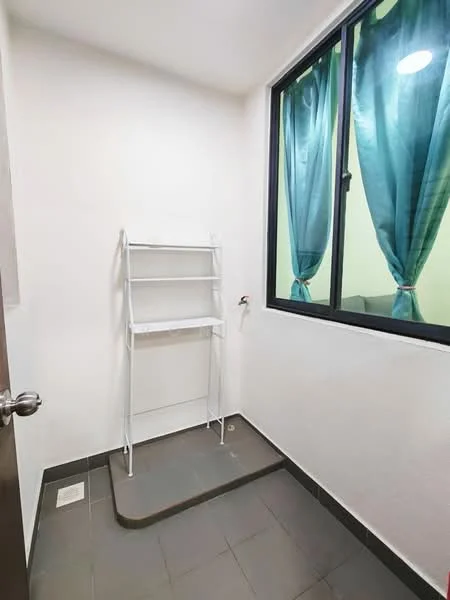 Laundry features: white painted walls, grey tile flooring, single window with sheer turquoise curtains, metal shelving unit, floor drain, wall-mounted water connection.