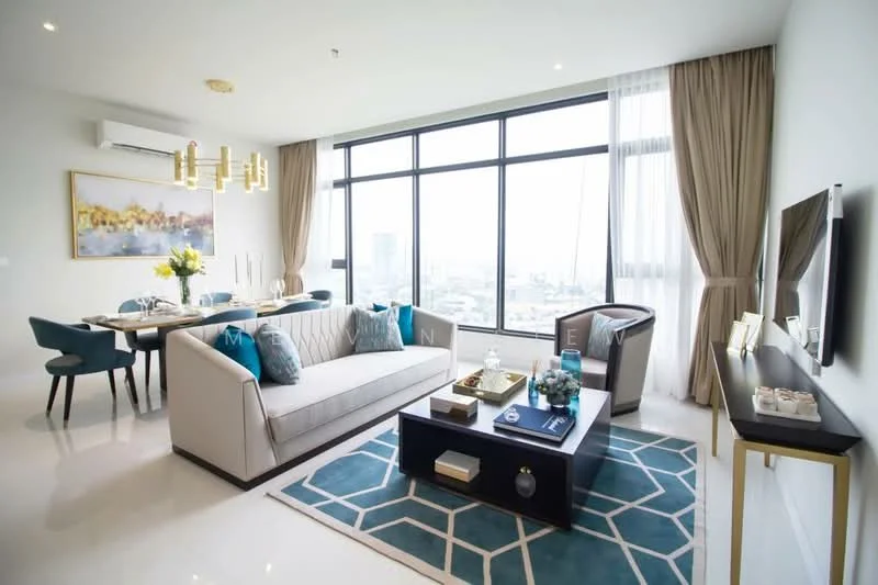 Living features: 3-seater fabric sofa in light grey, blue accent cushions, coffee table with glass top, area rug with geometric pattern, wall-mounted TV, TV console in dark wood, floor-to-ceiling windows, curtains in light beige, recessed downlights, chandelier with multiple bulbs, decorative vase with flowers, framed artwork on wall; style: modern; view: city. Dining features: 6-seater dining table in dark wood, upholstered dining chairs in blue, decorative centerpiece on table, wall-mounted artwork, recessed downlights; style: modern; view: city.