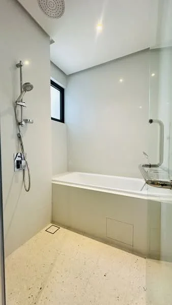 Bathroom features: walk-in shower with glass enclosure, bathtub, chrome handheld shower, chrome wall-mounted faucet, white tiled walls, light-colored flooring, recessed downlights, window for natural light; style: modern.