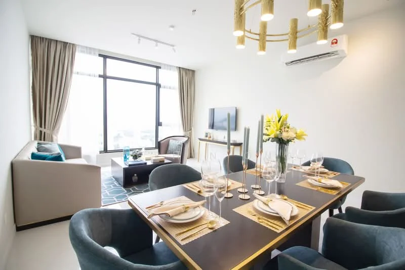 Dining features: 6-seater dining table, upholstered dining chairs in blue, decorative table setting with plates and glasses, golden chandelier, wall-mounted TV, floor-to-ceiling windows, curtains in beige, air conditioning unit, light-colored walls, area rug with geometric pattern; style: modern; view: city. Living features: fabric sofa in light color, coffee table, decorative cushions, TV console, area rug, floor-to-ceiling windows, curtains in beige; style: modern; view: city.