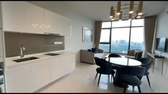 Kitchen features: white cabinetry, double-bowl stainless-steel sink, chrome pull-down faucet, grey backsplash, built-in oven, stainless-steel refrigerator, white countertop, recessed downlights; style: modern; view: city. Dining features: round dining table, upholstered dining chairs in blue, pendant light fixture, floor-to-ceiling windows, view of city skyline; style: modern; view: city. Living features: fabric sofa in grey, accent chairs, wall-mounted TV, decorative artwork, curtains, recessed downlights; style: modern; view: city.