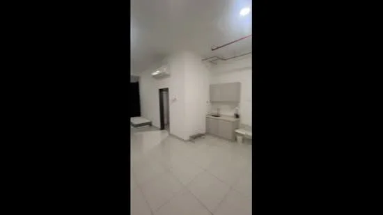 Room features: white painted walls, glossy tile flooring, recessed downlights, wall-mounted split AC, kitchen cabinetry in light color, sink, countertop, open layout; style: modern.