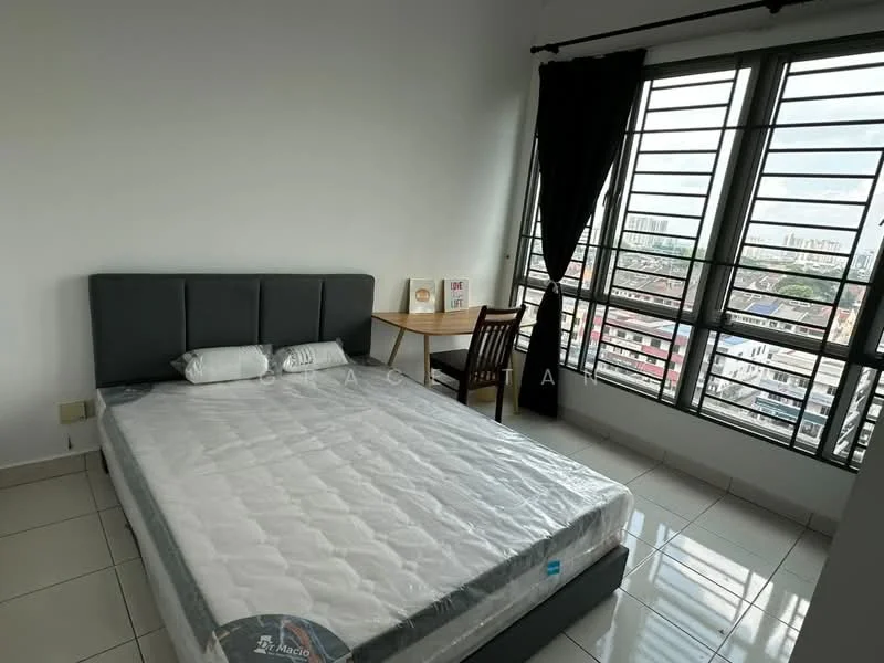 Bedroom features: queen-size bed with grey upholstered headboard, white mattress with protective cover, single bedside pillow, wooden study desk, wooden chair, floor-to-ceiling windows, blackout curtains, white painted walls, glossy tile flooring, city view from window; style: modern; view: city.