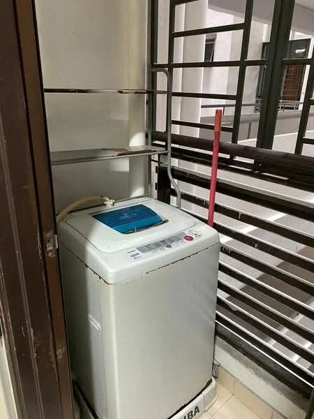 Laundry features: top-load washing machine, metal shelving unit, white walls, tile flooring, balcony railing, exposed plumbing, natural light from adjacent space.