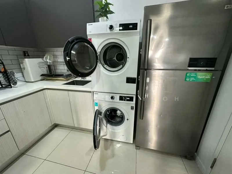 Laundry features: white front-load washing machine, white front-load dryer stacked, stainless-steel fridge, kitchen sink, grey cabinetry, white countertop, tile flooring, green plant on countertop; style: modern.