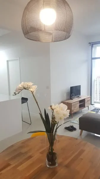 Dining features: round wooden dining table, 4 yellow dining chairs, decorative vase with white orchids, pendant light fixture, light grey walls, large window with natural light, wooden flooring, TV console with wooden finish, wall-mounted TV, sofa in living area visible; style: modern.