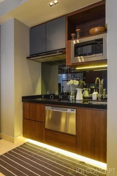 Kitchen features: black granite countertop, wood cabinetry, stainless-steel dishwasher, built-in microwave, stainless-steel sink, chrome pull-down faucet, glass upper cabinets, recessed downlights, strip lighting under cabinets, grey tile backsplash, kitchen island, flooring with area rug; style: modern.