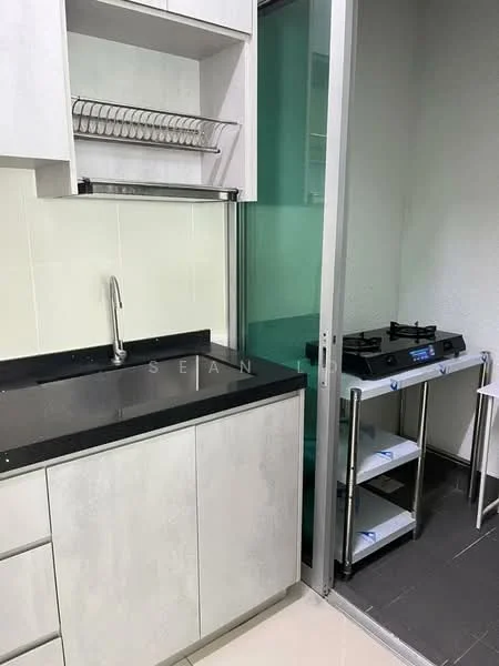 Kitchen features: single-bowl stainless-steel sink, chrome pull-down faucet, black granite countertop, white cabinetry with flat-panel design, open shelving above sink, gas stove with two burners, metal cart with shelves, white tiled backsplash, grey tiled flooring; style: modern.