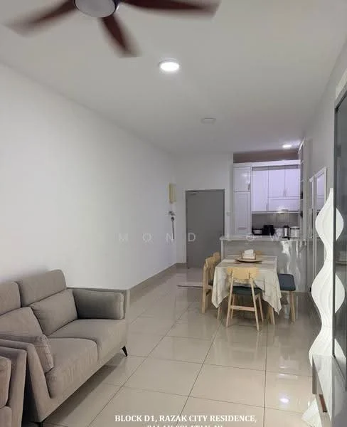 Living features: 3-seater fabric sofa in grey, light-colored walls, glossy tile flooring, ceiling fan, dining table with chairs, open layout, kitchen area visible in background, recessed lighting; style: modern.