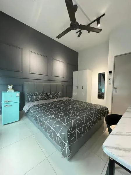 Bedroom features: king-size bed with grey geometric-patterned bedding, upholstered headboard, 5-blade ceiling fan with light, white painted walls, grey accent wall with paneling, built-in wardrobe with sliding doors, mirror on wall, white desk with marble top, turquoise mini fridge; style: modern.