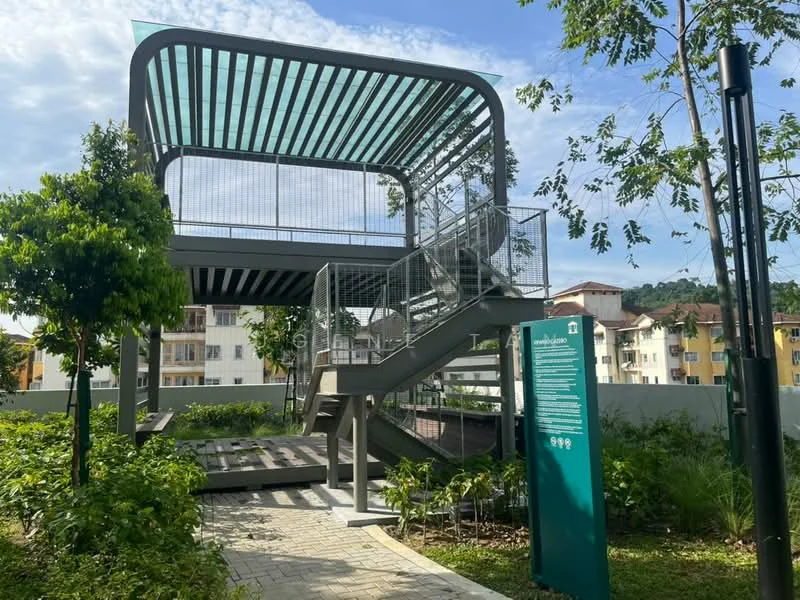 Exterior features: two-storey structure, metal framework, open-air design, staircase with metal railing, landscaped garden area, surrounding greenery, paved walkway, information signage, canopy roof, modern architectural style; style: modern.