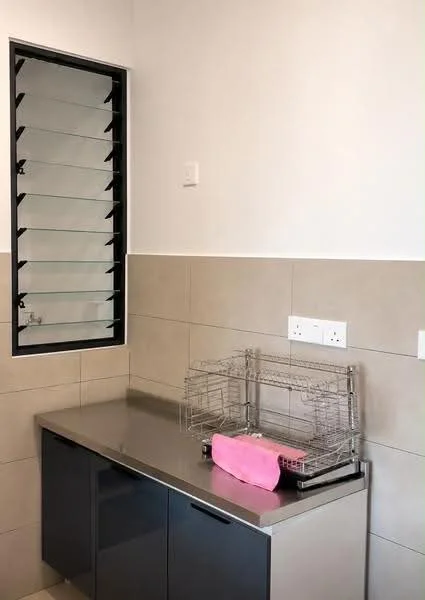 Laundry features: grey laminate countertop, dark cabinetry, dish drying rack, pink dish drying mat, white electrical outlets, sliding louvered window, beige tiled walls, light grey tiled flooring; style: modern.