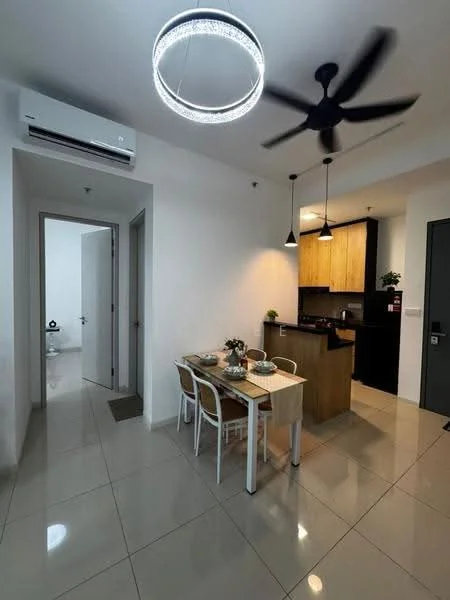 Dining features: 4-seater dining table, white chairs, pendant lighting, recessed downlights, wall-mounted split AC, cream painted walls, glossy tile flooring, open layout to kitchen, decorative plant on table; style: modern. Kitchen features: wood cabinetry, black countertop, stainless-steel sink, built-in stove, kitchen island, pendant lights above countertop; style: modern. Room features: white painted walls, glossy tile flooring, doorway to hallway, doorway to kitchen.