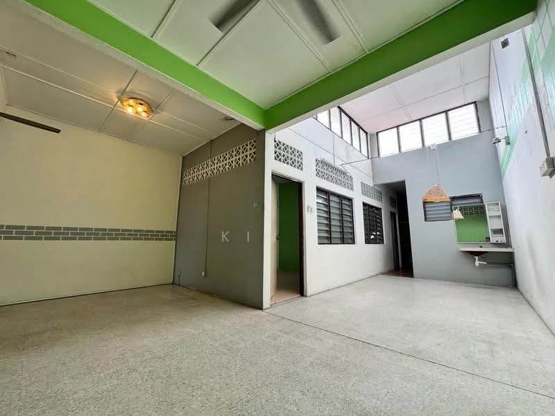 Room features: green accent wall, white painted walls, grey tiled wall, concrete flooring, ceiling fan, large windows, hanging light fixture, built-in shelf, open layout; style: modern.