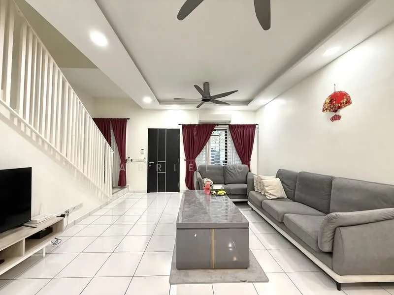 Living features: grey fabric L-shape sectional sofa, coffee table with grey surface, wall-mounted TV, white tiled flooring, white painted walls, recessed downlights, 5-blade ceiling fan, red curtains, decorative wall hanging, staircase with white railing; style: modern.