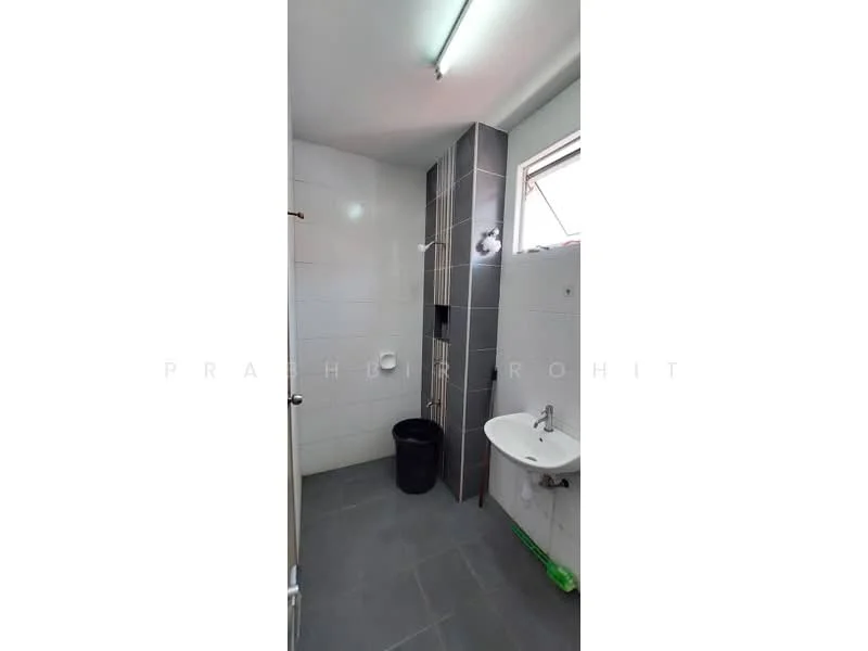 Bathroom features: white tiled walls, grey tiled flooring, shower area with glass partition, chrome shower head, wall-mounted faucet, white sink, toilet, window for natural light, ceiling light fixture; style: modern.